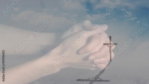 Praying hands over cross silhouette with cloudy sky in animation format