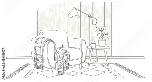 Cozy armchair with blanket and lamp in a room.