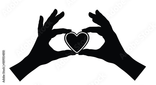 Hands forming a heart shape with a cutout striking silhouette