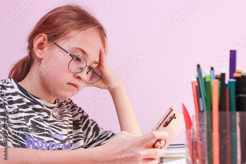 Digital distraction or learning stress: A Tired Teenage Girl with a Smartphone