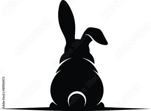 Silhouette of a rabbit sitting and facing away, with long ears up, black graphic