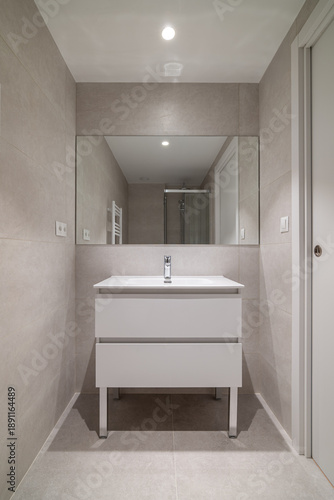 Wallpaper Mural Modern bathroom interior with a sleek white vanity, large mirror, and neutral tile walls. Bright lighting enhances the clean design. Torontodigital.ca