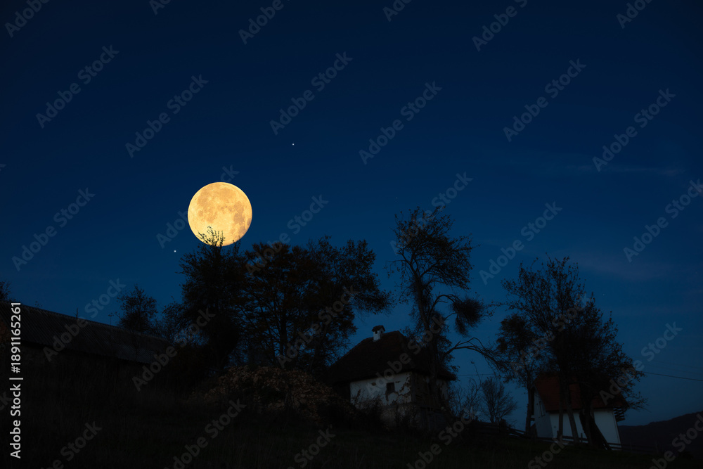 Fototapeta premium Full Moon, stars, planets and landscape scenery silhouettes.