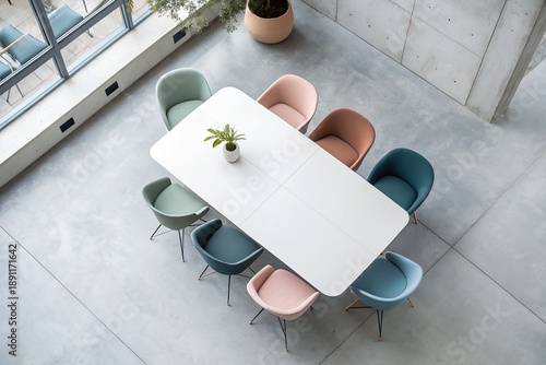 Modern Meeting Space: An inviting, top-down perspective of a contemporary conference room setup, showcasing an elegant white table encircled by a selection of stylish chairs, ideal for meetings.