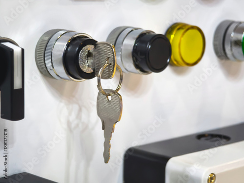 Key inserted into a lock showing a close-up view of a key and locking mechanism in a controlled setting