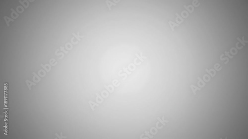 Abstract Radial Gray Gradient Background Seamless Loop. Subtle Monochromatic Spot Light Effect Fading from Bright White Center to Dark Grey Edges.