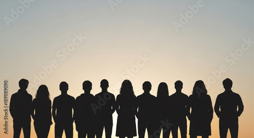 Silhouette of diverse group of people standing together outdoors.