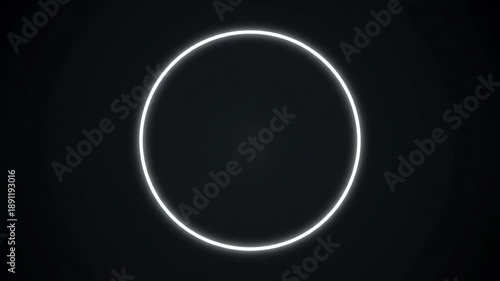 Glowing white circle on a black background with a bright rim and empty space below.