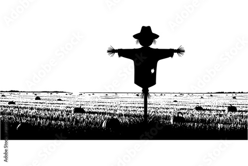 Silhouette of a scarecrow standing in a harvested field under a clear sky, evoking a rustic autumn scene