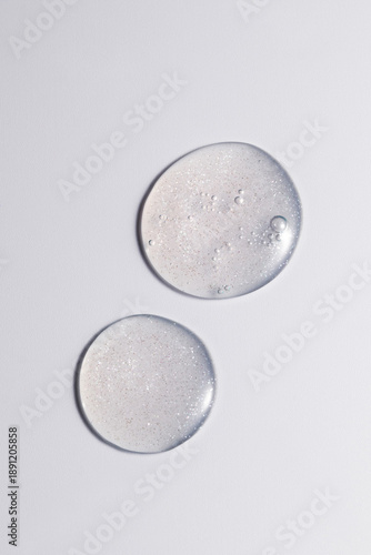 Macro shot of  facial serum swatch with glossy texture on a clean background