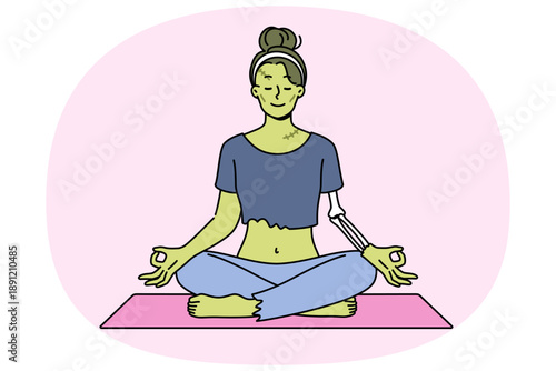 Green witch meditating in lotus position doing yoga on halloween to restore health after resurrection. Frankenstein woman doing yoga exercises wanting to achieve enlightenment in life