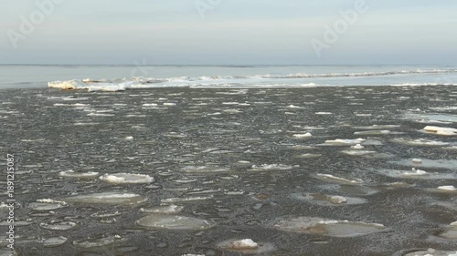 baltic sea beach winter cold  waves jurmala latvia