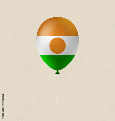 Niger flag on a 3D balloon floating in the air for a national holiday or patriotic celebration.