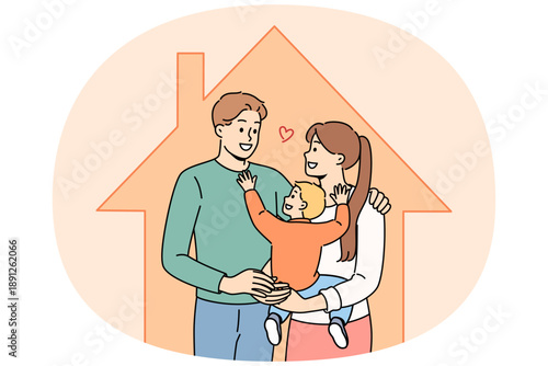 Family with baby is standing inside house after purchasing own home with mortgage or taking out property insurance. Happy husband and wife rejoice in renting new house in good area