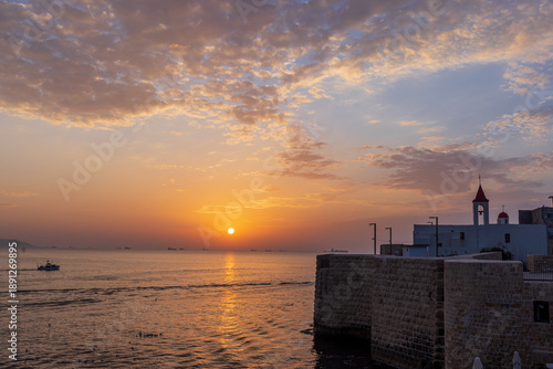 Sunset view of the old city of Acre or Akko , Israel