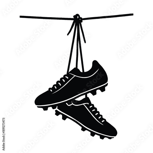 Football shoe soccer cleats hanging by their laces silhouette vector icon illustration on white background