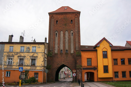 High Gate (Brama Wysoka), preserved from original defensive walls. Historic city gate served defensive, representative, and observation functions. Passageway, tall blind windows. Darłowo, Poland.