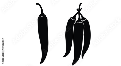 Two chili peppers in a striking black silhouette