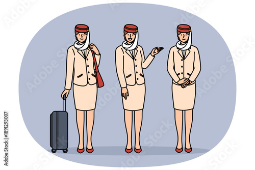 Women flight attendants of Arabian airlines, in traditional uniform with national hat and long skirt. Girls flight attendants offer to fly to Dubai or UAE and look at screen with smile