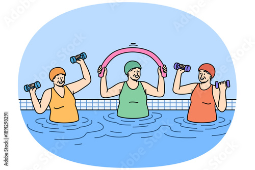 Elderly women working out in pool doing aqua fitness and lifting dumbbells to improve health. Happy pensioners lead active lifestyle and stand in water doing sports in pool after retirement