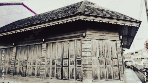Tableau sur toile Old wooden traditional house with weathered texture, vintage architecture, cultural heritage and nostalgic rural atmosphere