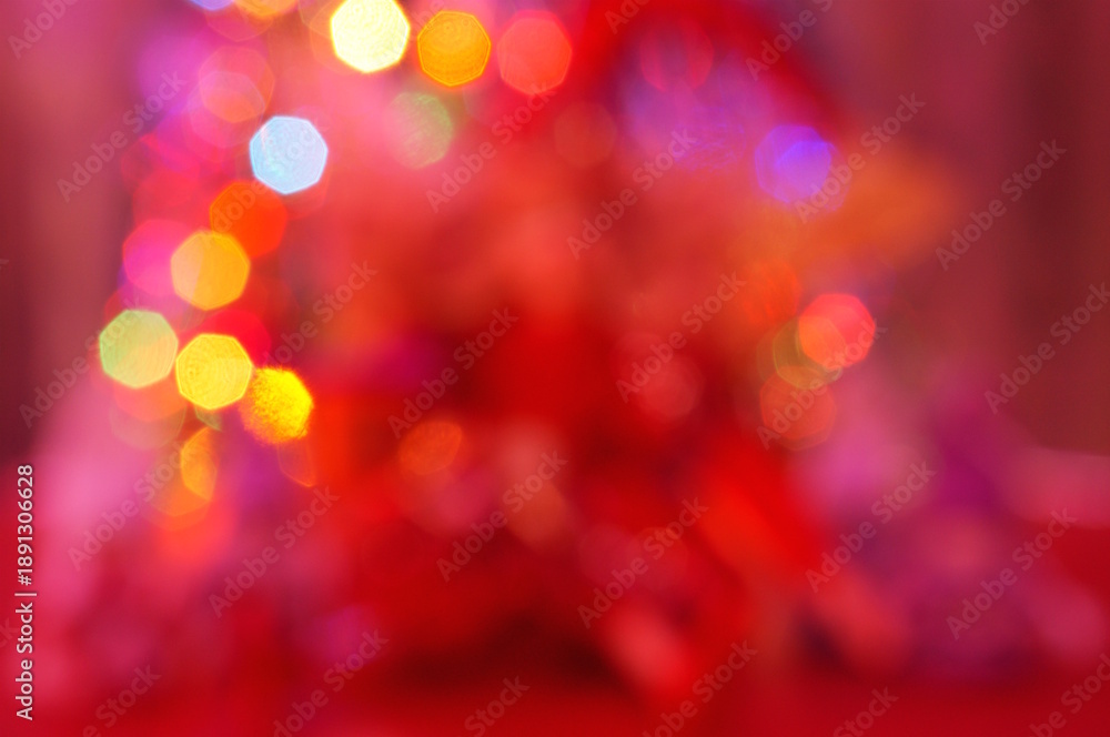 Fototapeta premium Blurred abstract Christmas background. Bokeh. Toys and glowing illumination. Red shade.