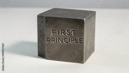 Solid Metal Cube Engraved with First Principle Concept for Learning