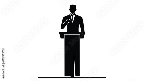 Businessman in suit stands confidently at podium speaking with gesture