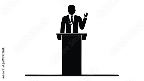 Silhouette of a businessman giving a presentation at a podium with a microphone