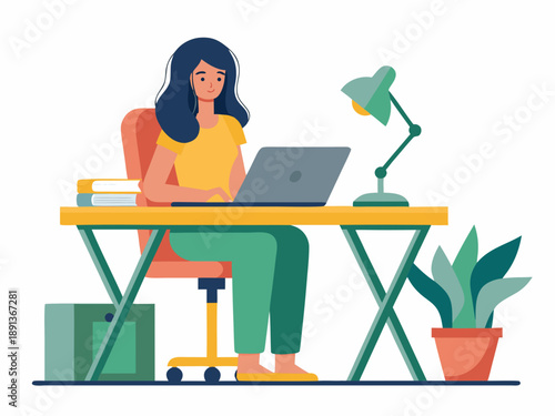 A young woman works on a laptop at a brightly colored desk