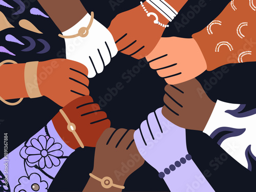 Diverse hands join together in a circle representing unity and collaboration