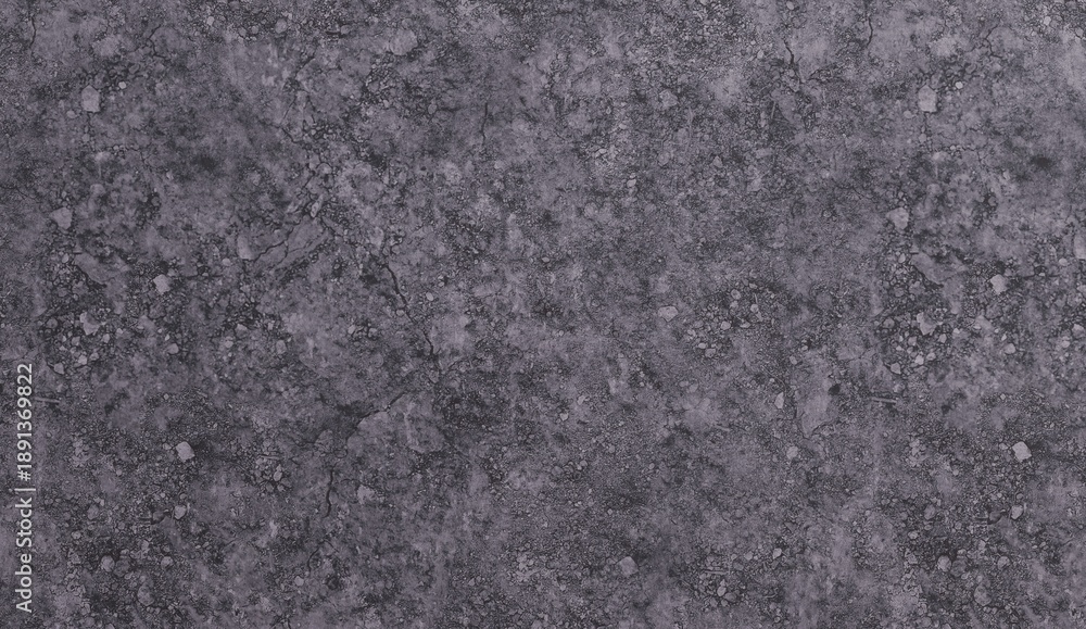 Fototapeta premium mottled dark gray surface with numerous small, light-colored particles and irregular textures. It resembles weathered asphalt or coarse concrete