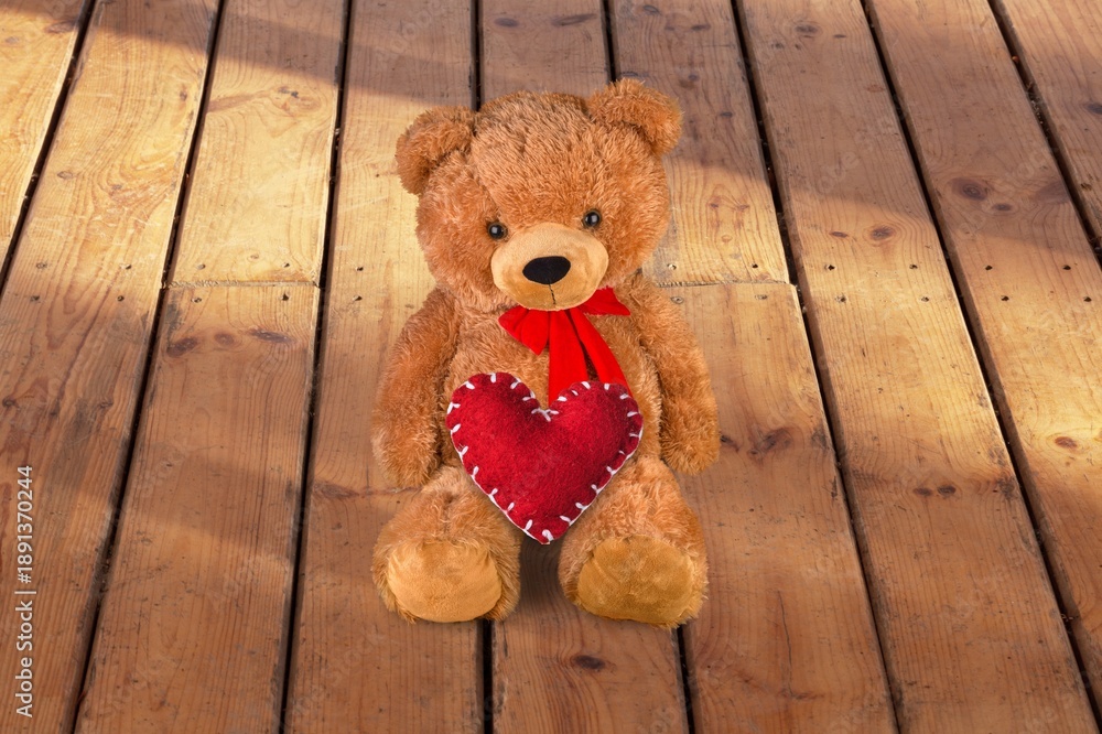 Naklejka premium Teddy Bear hold red heart, love concept
