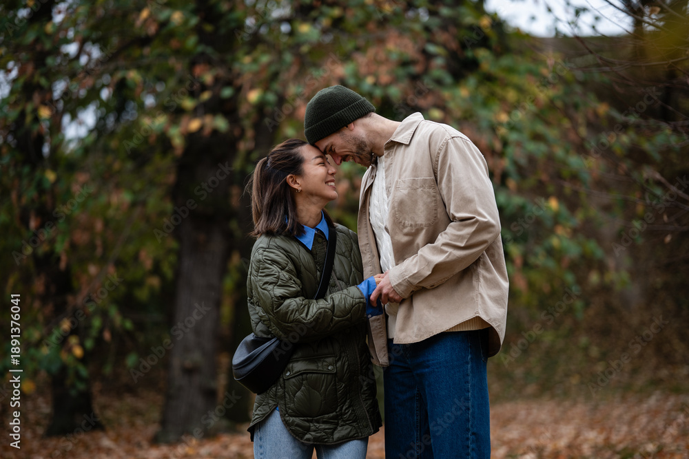 Fototapeta premium Happy loving couple enjoying autumn day outdoors