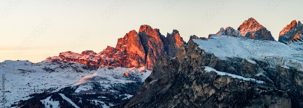 Fototapeta premium Panorama of the Dolomites mountains during autumn sunrise