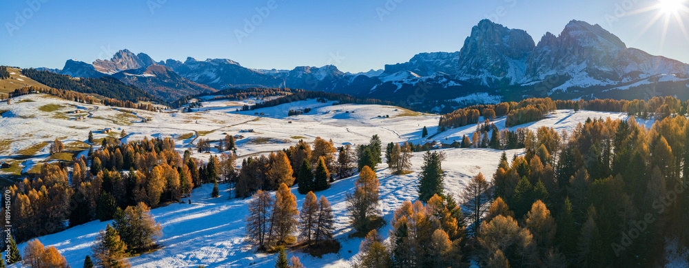 Fototapeta premium Panorama of the Dolomites mountains during autumn sunrise