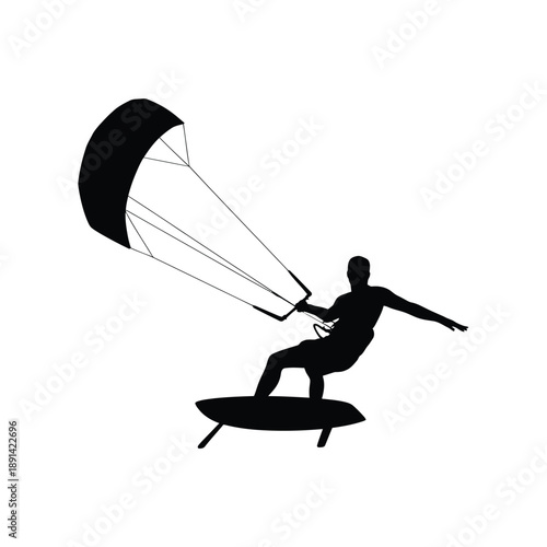 Silhouette of a kitesurfer riding a wave on a board
