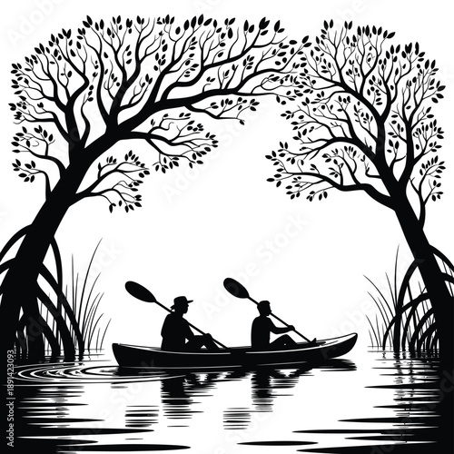 Silhouette of two people kayaking under a canopy of trees