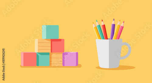 Colorful building blocks stacked next to a white mug of crayons on a yellow background