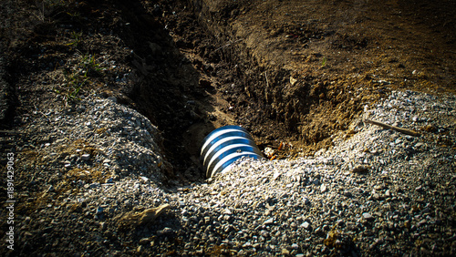 Εκτύπωση καμβά a culvert pipe installed in a trench, a drainage solution
