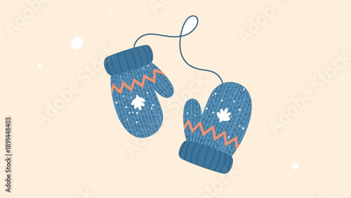 Cozy blue knitted mittens with a playful zigzag pattern and snowflake motifs