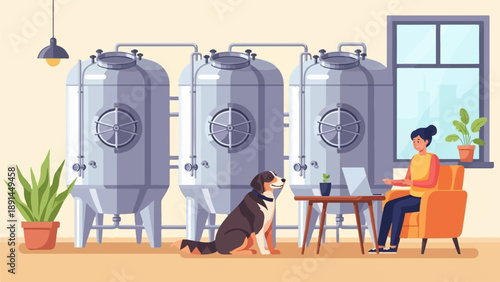 A woman works on a laptop next to large tanks, with a dog