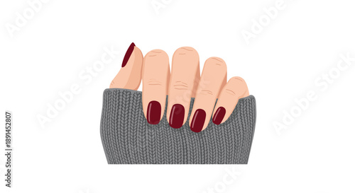 Manicured Hands with Square Dark Red Nails Resting on a Grey Knitted Fabric for Cozy Winter Fashion Style.