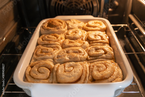 Baking cinnamon rolls in the oven: fresh homemade pastry