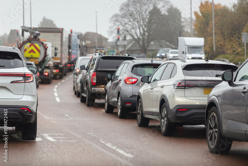 Canvas Print Traffic jam congestion with rows of cars  at traffic lights on highway road in r