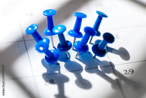 Important date many thumbtacks in one busy day being fully booked and overworked