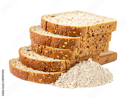 Pile sliced whole wheat dry integral bread with wholewheat flour isolated on white background, side view
