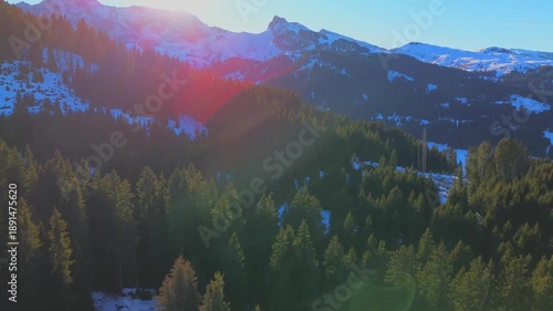 Aerial view. People skiing. Winter holidays. Snow-covered coniferous trees and roads on the tops of the Alpine mountains. Skier Winter. Wide angle drone view. Sun. Alpe di Siusi Italy 20.01.2026