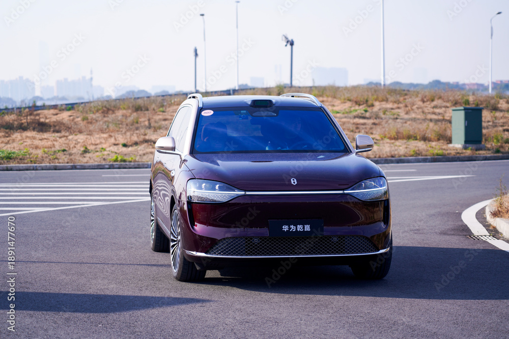 Naklejka premium Chinese brand cars using Huawei's intelligent driving system are currently undergoing testing and trial drives.