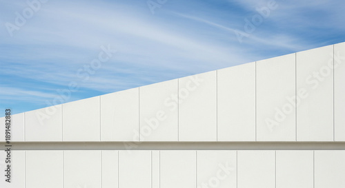Minimalist Architecture: White Wall and Blue Sky Abstraction